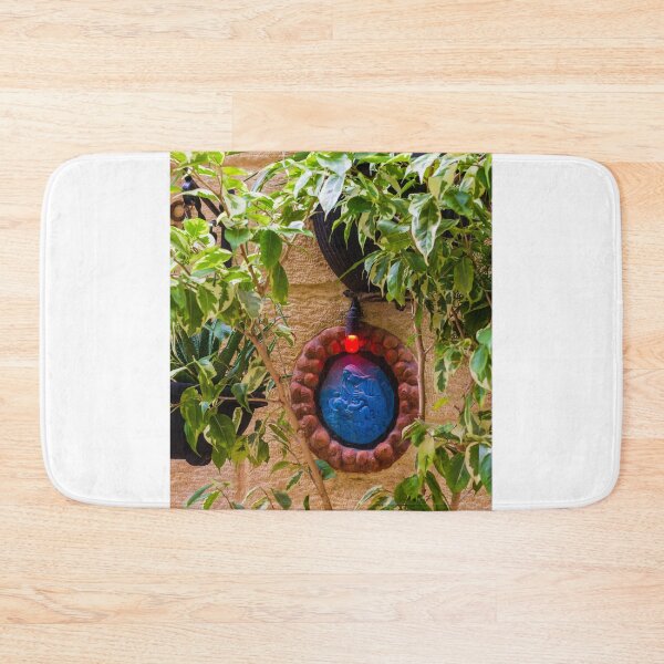 Item preview, Blue Religious Wall Medallion With Red Light Nestled Among Green Garden Foliage On Stone designed and sold by Nmallia.