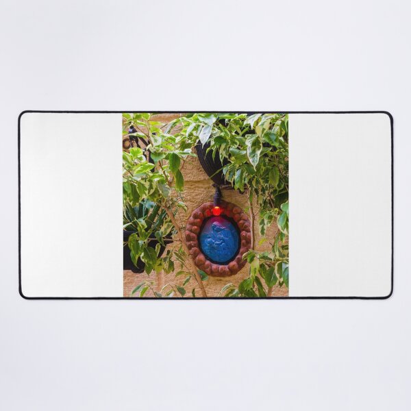 Item preview, Blue Religious Wall Medallion With Red Light Nestled Among Green Garden Foliage On Stone designed and sold by Nmallia.