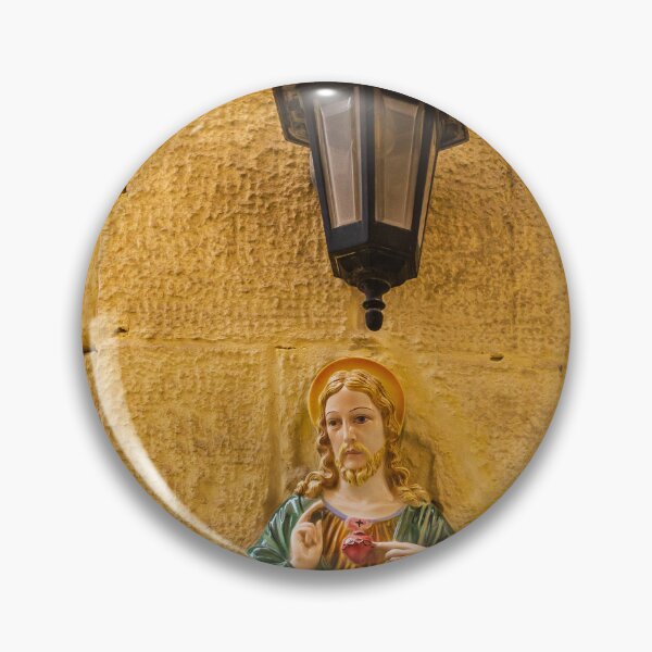 Item preview, Jesus Sacred Heart Statue Beside Vintage Wall Lamp On Stone Church Wall In Warm Light designed and sold by Nmallia.