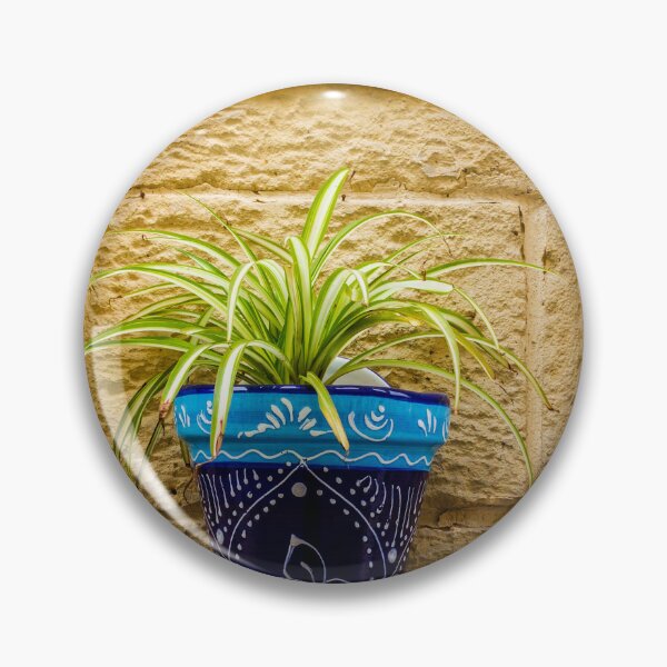 Item preview, Blue Ceramic Pot With Green Potted Plant Hanging On Textured Stone Wall In Sunny Outdoor Decor designed and sold by Nmallia.