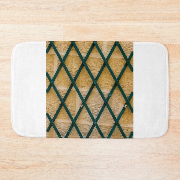 Item preview, Green Wooden Lattice Trellis On Textured Yellow Stone Wall With Geometric Pattern And Texture designed and sold by Nmallia.