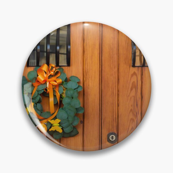 Item preview, Easter Wreath With Orange Ribbon On Rustic Wooden Door With Decorative Iron Grilles designed and sold by Nmallia.