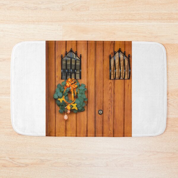 Item preview, Easter Wreath With Orange Ribbon On Rustic Wooden Door With Decorative Iron Grilles designed and sold by Nmallia.