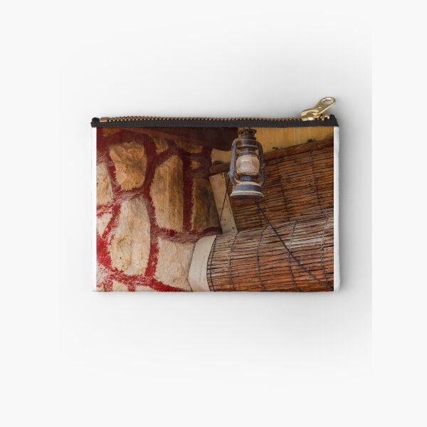 Item preview, Rustic Lantern Hanging Beside Stone Wall and Terracotta Roof Over Wooden Door in Vintage Exterior designed and sold by Nmallia.