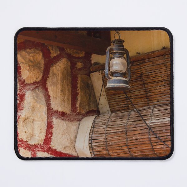 Item preview, Rustic Lantern Hanging Beside Stone Wall and Terracotta Roof Over Wooden Door in Vintage Exterior designed and sold by Nmallia.