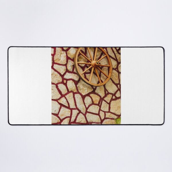Item preview, Rustic Wagon Wheel Mounted on Textured Stone Wall With Red Grout Accent for Exterior Decor designed and sold by Nmallia.