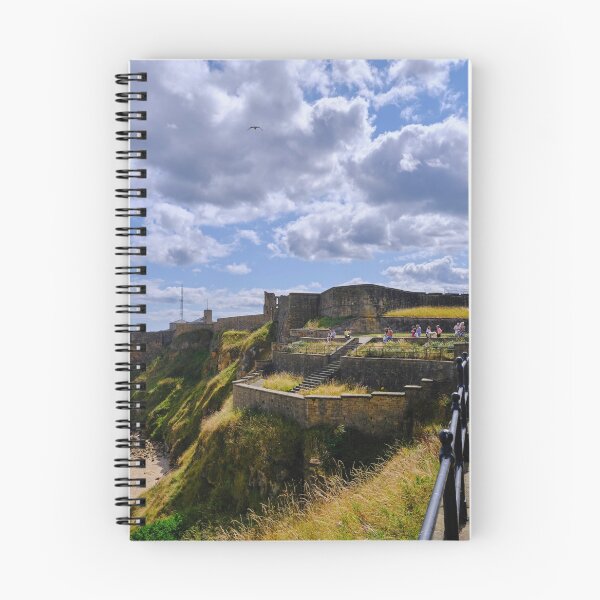 Item preview, Tynemouth Castle and King Edwards Bay under a blue sky with white clouds designed and sold by Violaman.