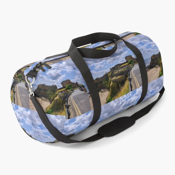 Item preview, Tynemouth Castle and King Edwards Bay under a blue sky with white clouds designed and sold by Violaman.