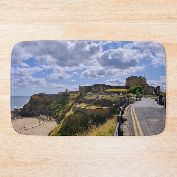 Item preview, Tynemouth Castle and King Edwards Bay under a blue sky with white clouds designed and sold by Violaman.