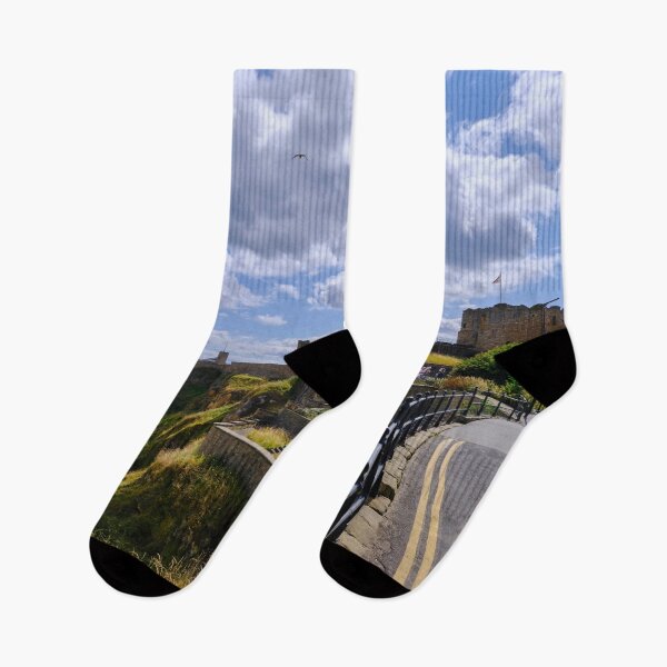 Item preview, Tynemouth Castle and King Edwards Bay under a blue sky with white clouds designed and sold by Violaman.