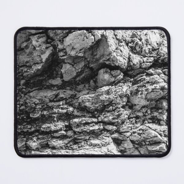 Item preview, Rugged Rock Texture Close-Up In Black And White Showing Layered Stone And Geological Detail designed and sold by Nmallia.
