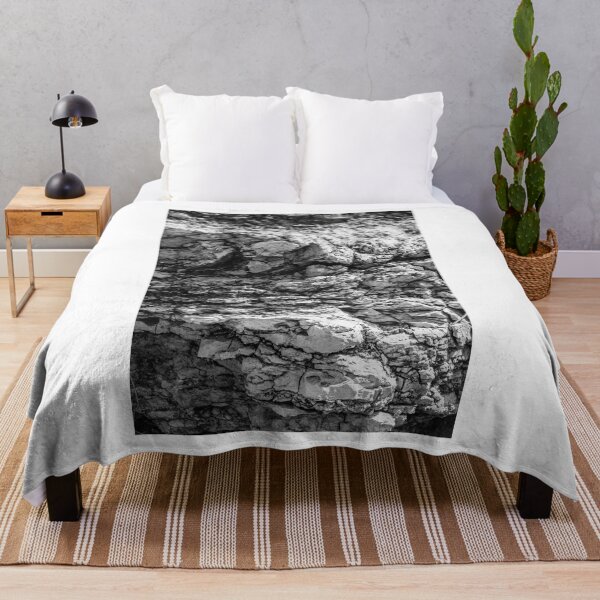 Item preview, Rugged Rock Texture Close-Up In Black And White Showing Layered Stone And Geological Detail designed and sold by Nmallia.
