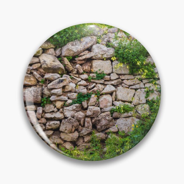 Item preview, Old Dry Stone Wall Covered With Green Vines And Wildflowers In Lush Meadow designed and sold by Nmallia.