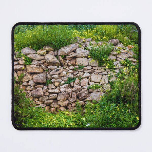 Item preview, Old Dry Stone Wall Covered With Green Vines And Wildflowers In Lush Meadow designed and sold by Nmallia.