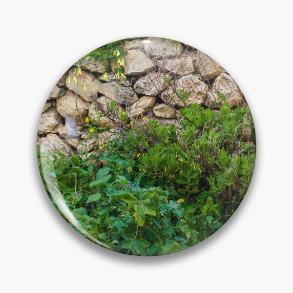 Item preview, Old Dry Stone Wall Covered With Green Vines And Wildflowers In Lush Meadow designed and sold by Nmallia.