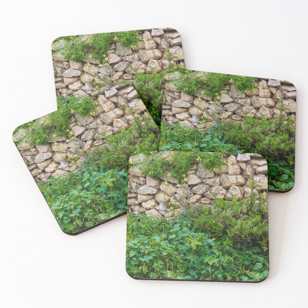 Item preview, Old Dry Stone Wall Covered With Green Vines And Wildflowers In Lush Meadow designed and sold by Nmallia.
