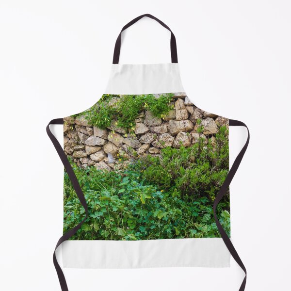 Item preview, Old Dry Stone Wall Covered With Green Vines And Wildflowers In Lush Meadow designed and sold by Nmallia.