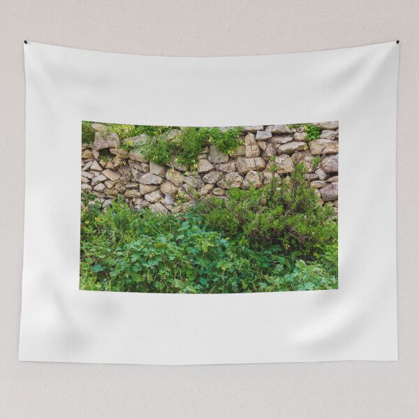 Item preview, Old Dry Stone Wall Covered With Green Vines And Wildflowers In Lush Meadow designed and sold by Nmallia.