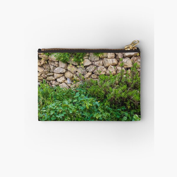 Item preview, Old Dry Stone Wall Covered With Green Vines And Wildflowers In Lush Meadow designed and sold by Nmallia.