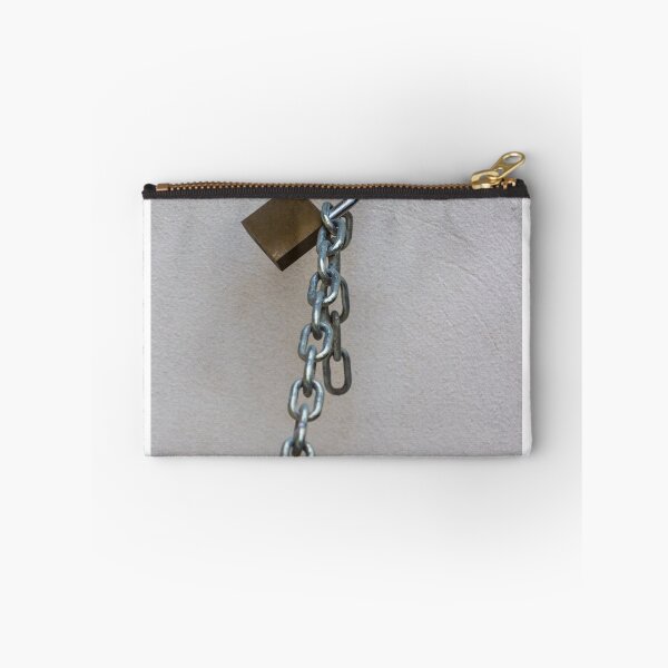 Item preview, Rusty Padlock And Hanging Chain Secured To Wall Representing Security And Restriction Concept designed and sold by Nmallia.