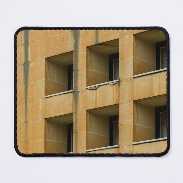 Item preview, Symmetrical Grid Of Square Windows On Weathered Sandstone Building Facade With Vertical Stains designed and sold by Nmallia.