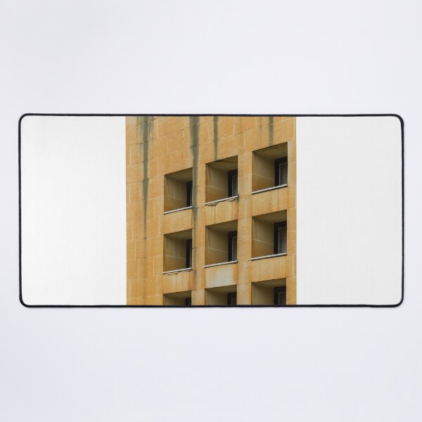 Item preview, Symmetrical Grid Of Square Windows On Weathered Sandstone Building Facade With Vertical Stains designed and sold by Nmallia.