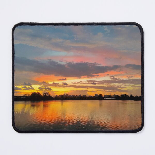 Item preview, Shillhoute of trees and water body under Orange sky at evening designed and sold by MagicMaker1984.