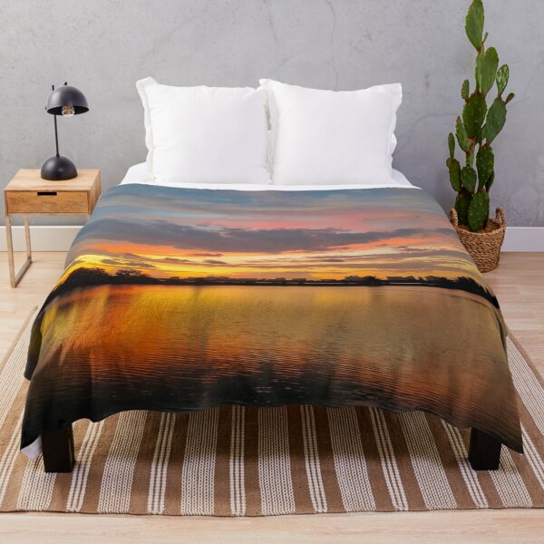 Item preview, Shillhoute of trees and water body under Orange sky at evening designed and sold by MagicMaker1984.
