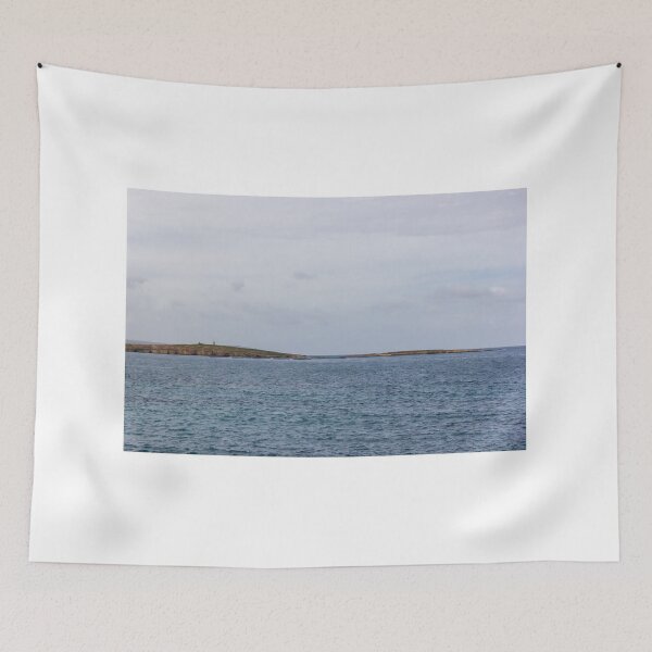 Item preview, Calm Ocean Seascape With Distant Island Lighthouse on Rocky Coastal Horizon Under Overcast Sky designed and sold by Nmallia.