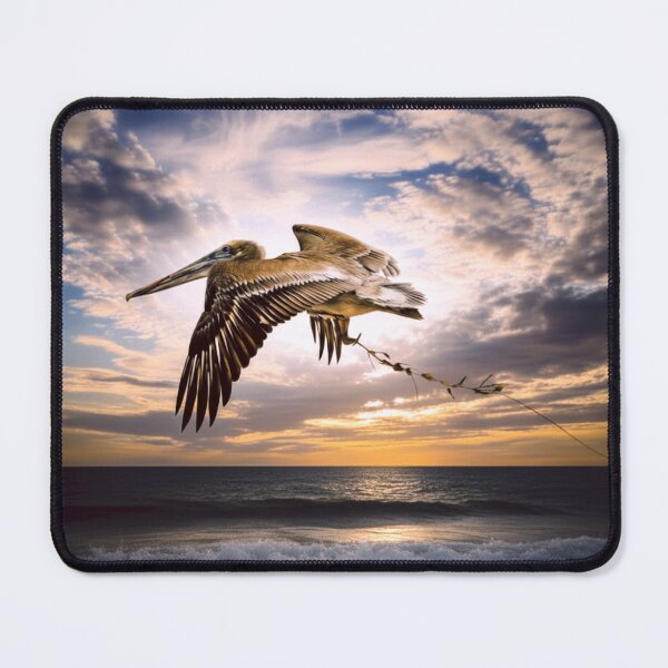 Item preview, Pelican flying over the Ocean and Waves Photo Print designed and sold by RevolveArt67.