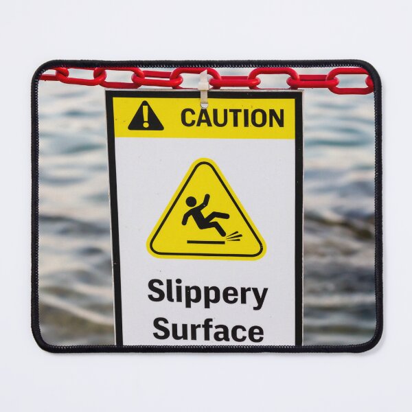 Item preview, Caution Slippery Surface Sign Hanging on Red Chain Over Water Near Dock or Shore designed and sold by Nmallia.