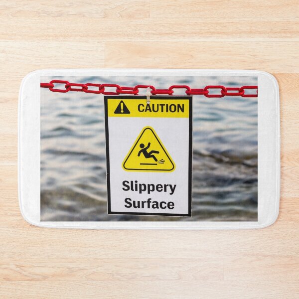 Item preview, Caution Slippery Surface Sign Hanging on Red Chain Over Water Near Dock or Shore designed and sold by Nmallia.