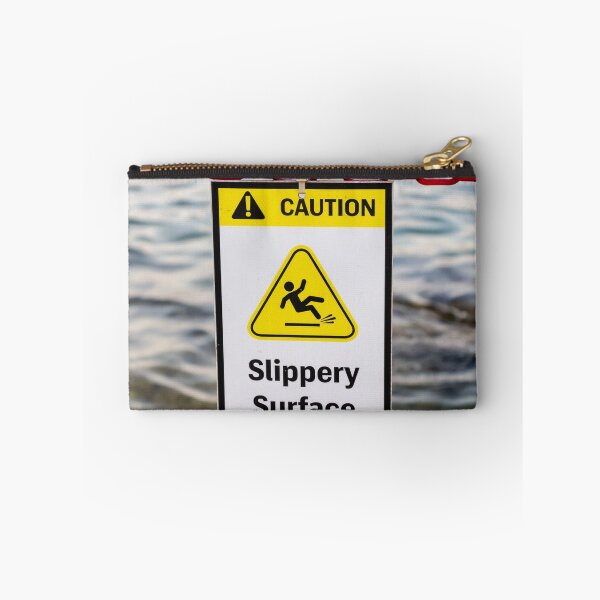 Item preview, Caution Slippery Surface Sign Hanging on Red Chain Over Water Near Dock or Shore designed and sold by Nmallia.