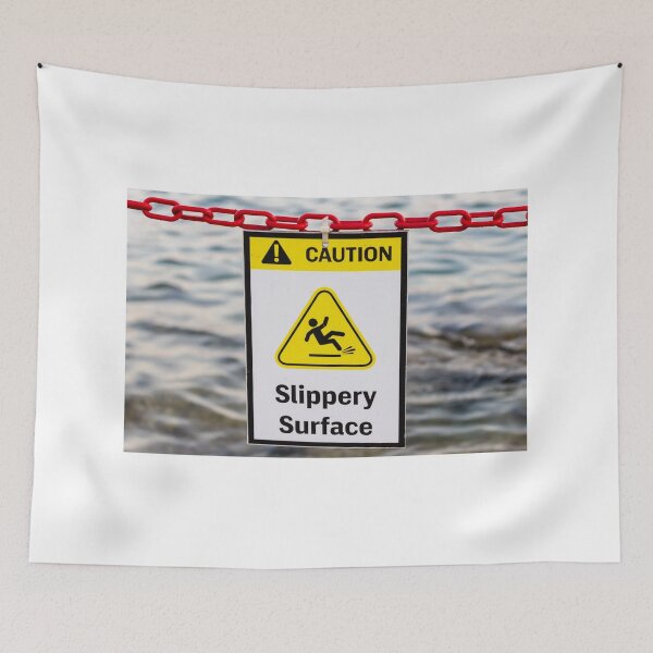 Item preview, Caution Slippery Surface Sign Hanging on Red Chain Over Water Near Dock or Shore designed and sold by Nmallia.