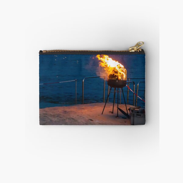 Item preview, Flaming Portable Grill On Rocky Beach At Night With Ocean Background And Sparks designed and sold by Nmallia.