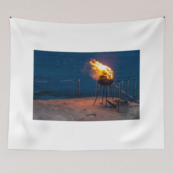 Item preview, Flaming Portable Grill On Rocky Beach At Night With Ocean Background And Sparks designed and sold by Nmallia.
