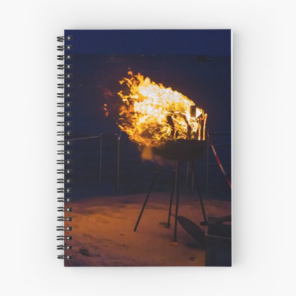 Item preview, Flaming Portable Grill On Rocky Beach At Night With Ocean Background And Sparks designed and sold by Nmallia.