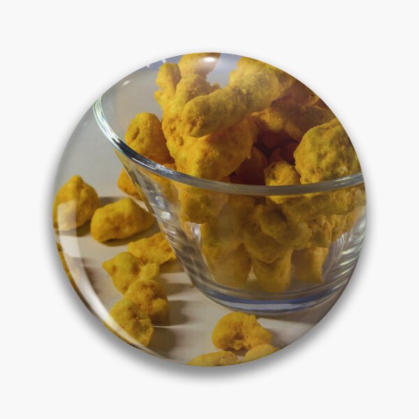 Item preview, Cheesy Corn Puffs Snack In Glass Bowl With Scattered Pieces On White Background designed and sold by Nmallia.