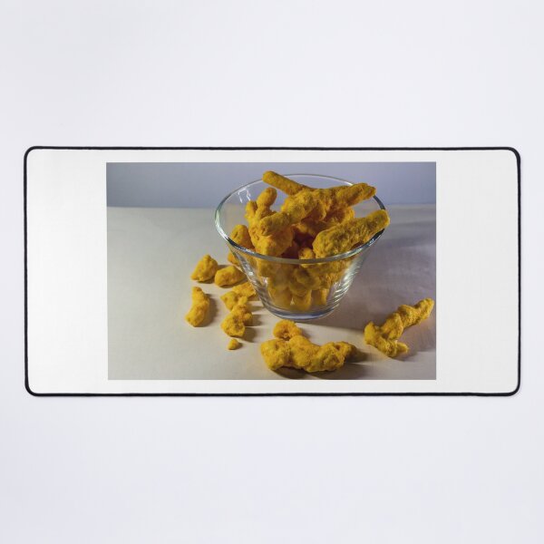 Item preview, Cheesy Corn Puffs Snack In Glass Bowl With Scattered Pieces On White Background designed and sold by Nmallia.