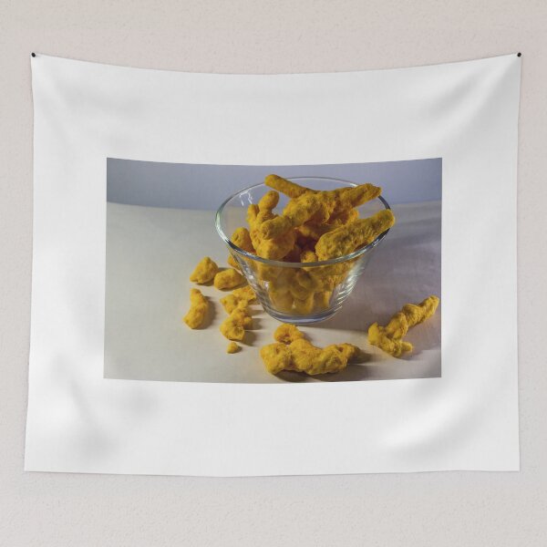 Item preview, Cheesy Corn Puffs Snack In Glass Bowl With Scattered Pieces On White Background designed and sold by Nmallia.