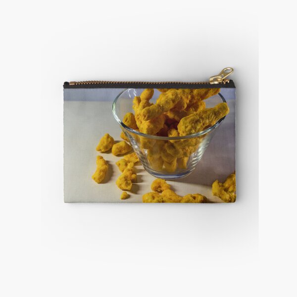 Item preview, Cheesy Corn Puffs Snack In Glass Bowl With Scattered Pieces On White Background designed and sold by Nmallia.