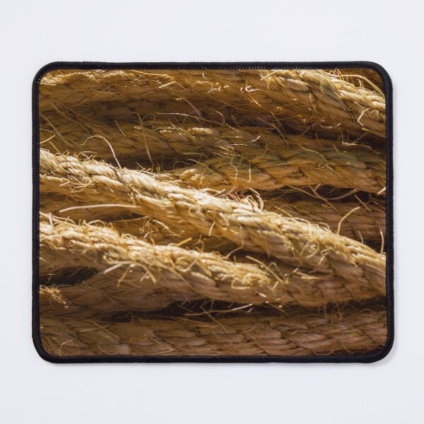 Item preview, Coiled Natural Hemp Rope Close-Up Texture for Nautical and Industrial Use in Warm Light designed and sold by Nmallia.