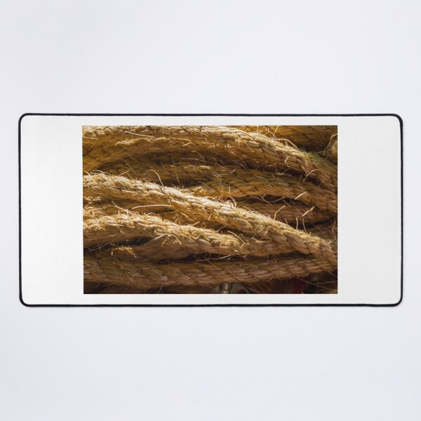 Item preview, Coiled Natural Hemp Rope Close-Up Texture for Nautical and Industrial Use in Warm Light designed and sold by Nmallia.