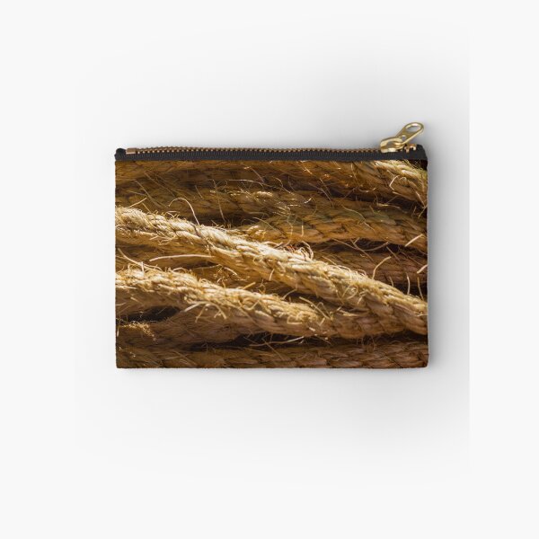 Item preview, Coiled Natural Hemp Rope Close-Up Texture for Nautical and Industrial Use in Warm Light designed and sold by Nmallia.