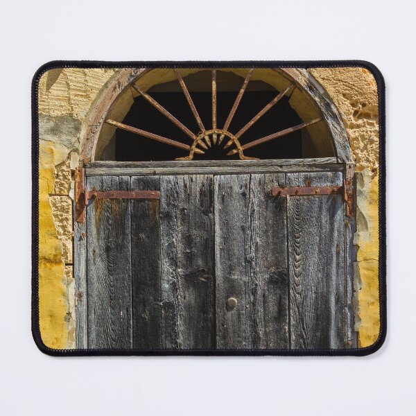 Item preview, Weathered Wooden Door In Arched Yellow Stone Facade With Rusted Hinges And Vintage Charm designed and sold by Nmallia.