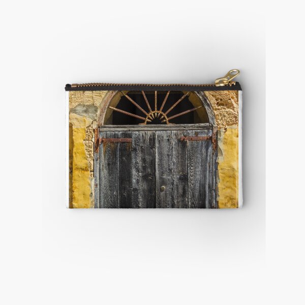 Item preview, Weathered Wooden Door In Arched Yellow Stone Facade With Rusted Hinges And Vintage Charm designed and sold by Nmallia.