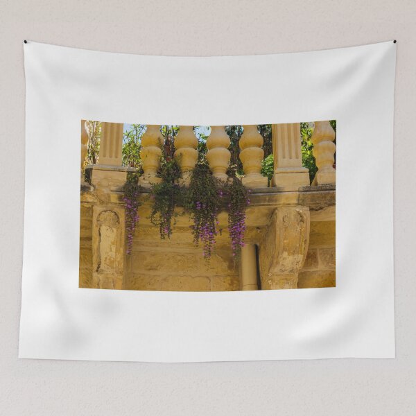 Item preview, Rustic Stone Balcony With Purple Hanging Flowers and Ornate Balustrade in Warm Sunlight designed and sold by Nmallia.