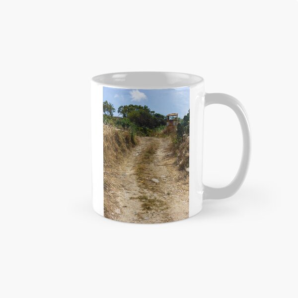 Item preview, Rural Dirt Road Leading Through Dry Field Toward Abandoned Tractor And Mediterranean Shrubland designed and sold by Nmallia.
