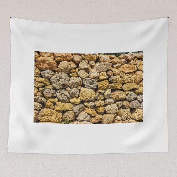 Item preview, Sunlit Dry Stone Wall of Rough Limestone Rocks Showing Texture and Rustic Mediterranean Character designed and sold by Nmallia.