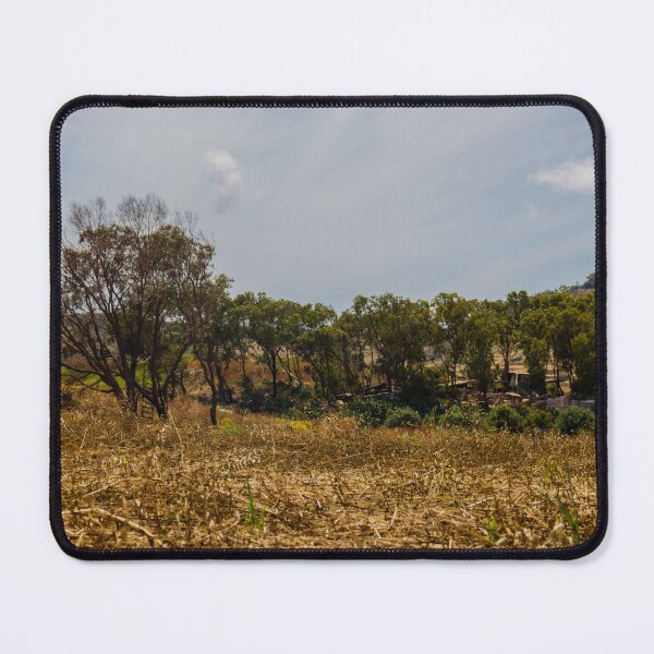 Item preview, Dry Harvest Field With Tree Line and Terraced Hillside Landscape Under Overcast Sky designed and sold by Nmallia.